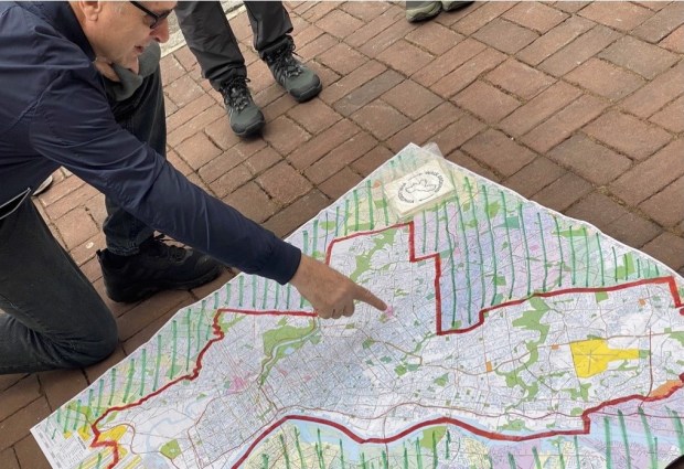 Map reading is an acquired skill that is one of the perks for Walk Around Philly participants. (Photo by JJ Tiziou)