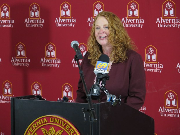 Alvernia University president Dr. Glynis A. Fitzgerald speaks during a "wall breaking" ceremony for the school's renovation of downtown Reading's historic American House. Through a partnership with Berks Community Health Center, the building will be fit with a community-based health center. (DAVID MEKEEL - READING EAGLE)