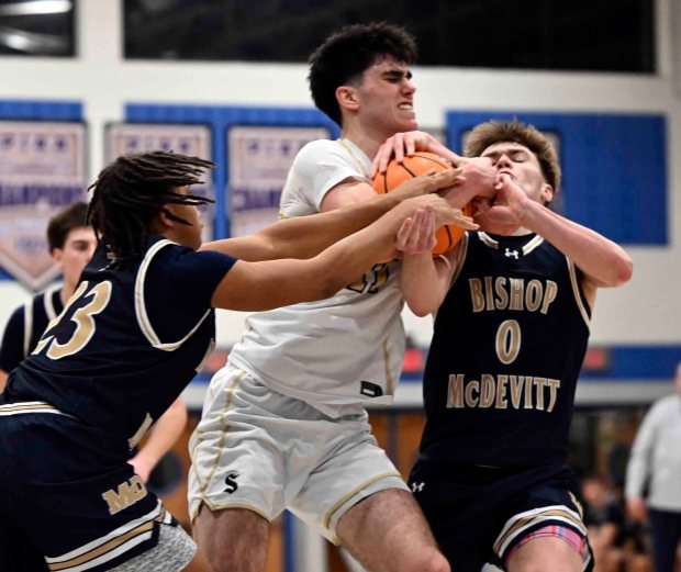 Berks Catholic's Johnny Giesa fights for a rebound in a 58-52 overtime District 3 Class 4A victory over the Crusaders on Friday, Feb. 27, 2026, at Garden Spot High School in New Holland. (BILL UHRICH/READING EAGLE)