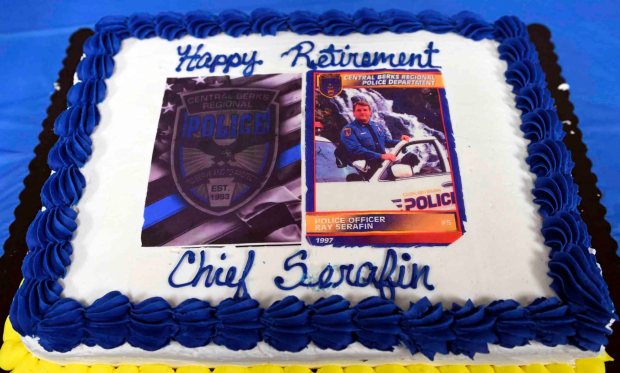 A retirement cake was part of the ceremony honoring Central Berks Police Chief Raymond Serafin. (BILL UHRICH/READING EAGLE)