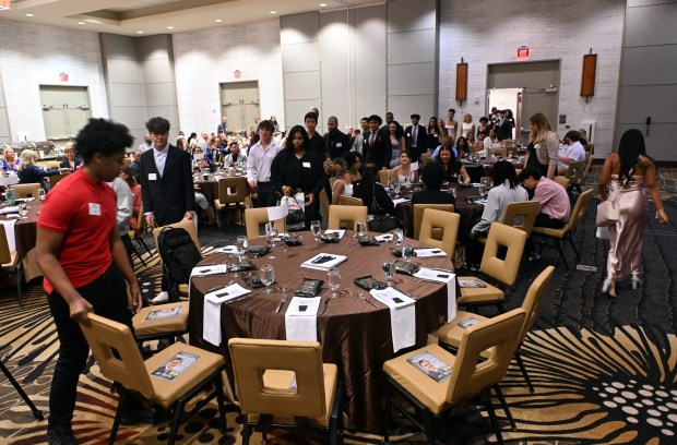 Students process into a banquet for the class of 2025 Emerging Entrepreneurs Academy on Friday, Aug. 1, 2025, at the DoubleTree by Hilton Hotel, 701 Penn St. (BILL UHRICH/MEDIANEWS GROUP)