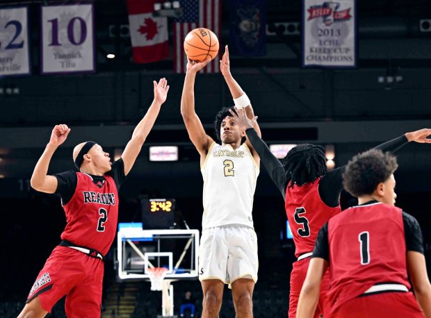 Berks Catholic's Kingston McCoy takes one of his five 3-pointers against Reading in a 62-57 Saints victory over the Red Knights in the BCIAA boys' final on Friday, Feb. 13, 2026, at the Santander Arena. (BILL UHRICH/READING EAGLE)