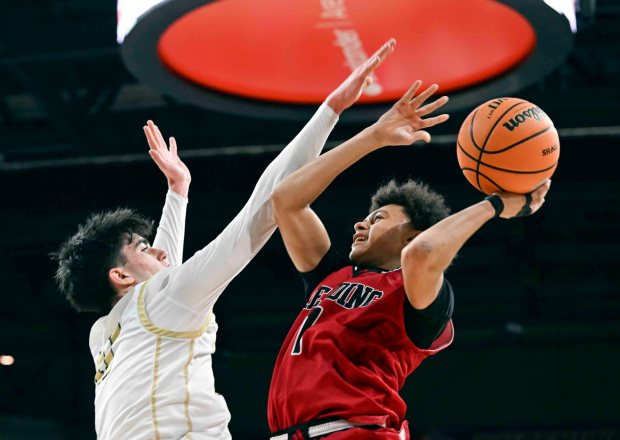 Reading's Javon Merriweather goes for two of his eight points against Berks Catholic in a 62-57 Saints victory over the Red Knights in the BCIAA boys' final on Friday, Feb. 13, 2026, at the Santander Arena. (BILL UHRICH/READING EAGLE)