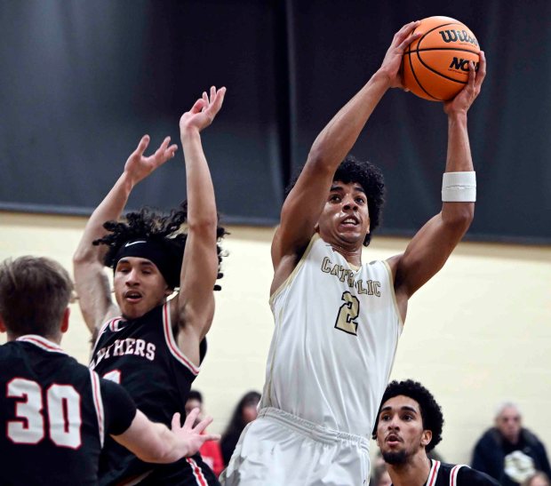 Berks Catholic's Kingston McKoy gets two of his game-high 18 points in a 62-35 District 3 Class 4A victory on Tuesday, Feb. 24, 2026, at Lloyd Wolf Gymnasium. (BILL UHRICH/READING EAGLE)