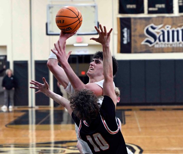 Berks Catholic's Johnny Giesa scores two of his eight points in a 62-35 District 3 Class 4A victory on Tuesday, Feb. 24, 2026, at Lloyd Wolf Gymnasium. (BILL UHRICH/READING EAGLE)