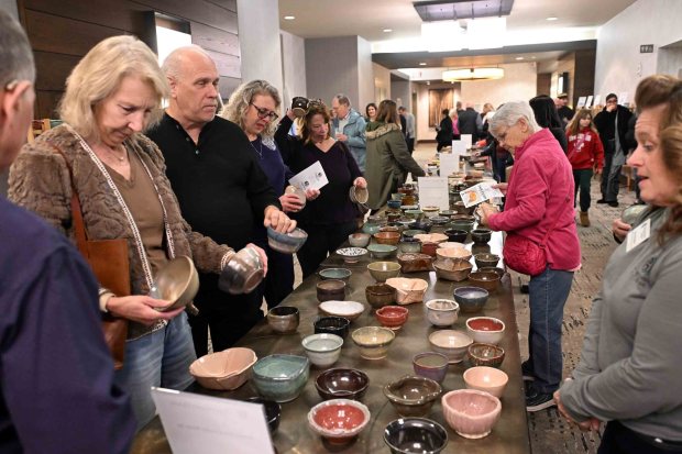 Guests choose a handcrafted bowl by local artists at the 24th annual Souper Bowl to benefit Opportunity House at the DoubleTree by Hilton hotel, 701 Penn St., on Monday, Feb. 2, 2026. (BILL UHRICH/READING EAGLE)