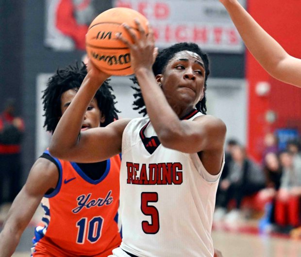 Reading's Jostin DeCastro drives against York for two of his team-high 20 points in an 86-69 District 3 Class 6A loss to the Bearcats on Tuesday, Feb. 17, 2026, at the Geigle. (BILL UHRICH/READING EAGLE)
