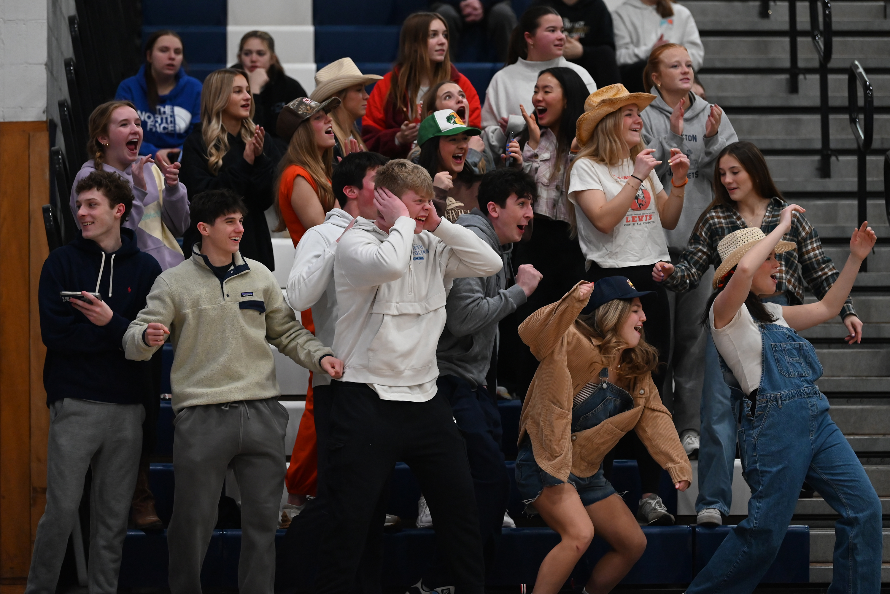 Abington Heights student section cheers on their team during the...