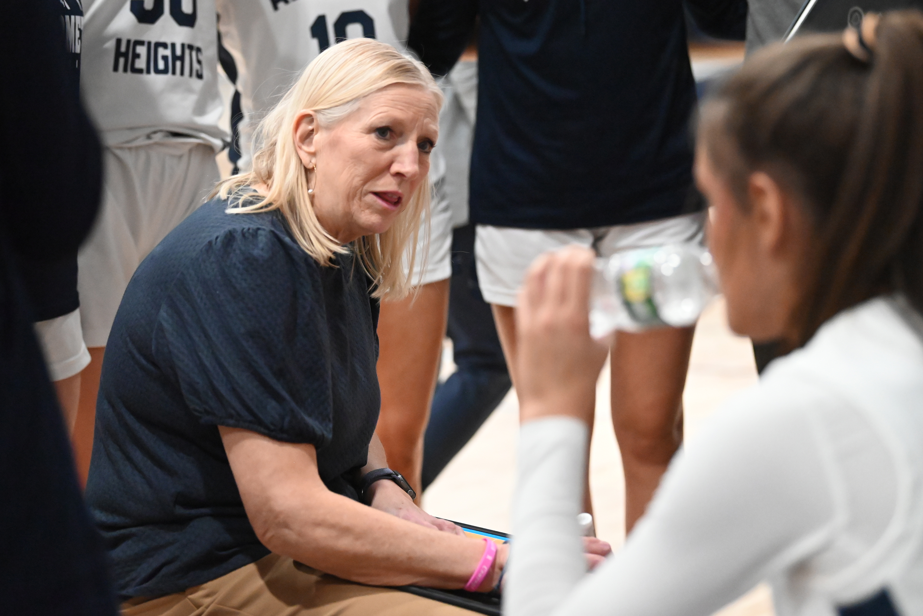 Abington Heights head coach Deanna Klingman talks to her players...