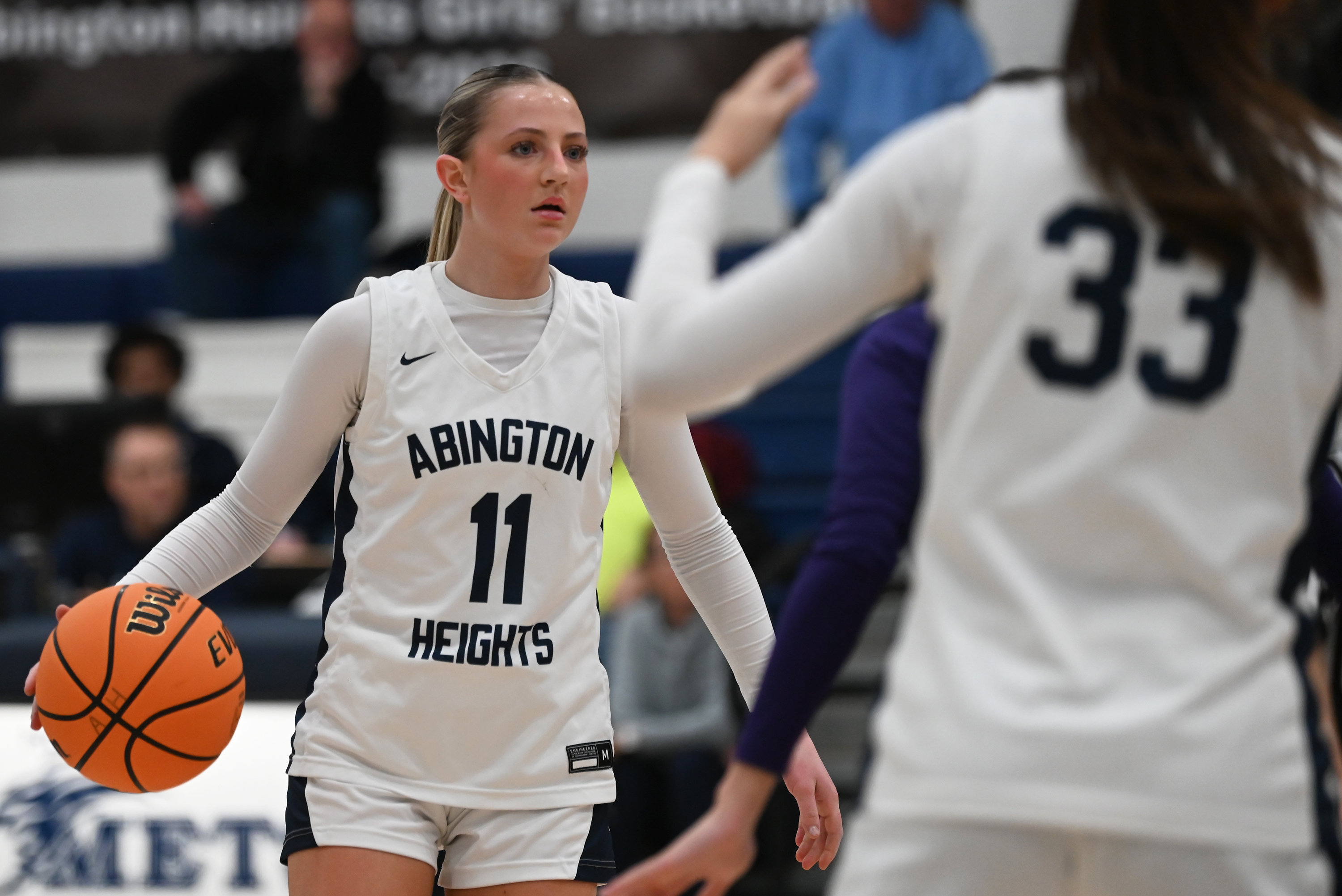 Abington Heights’ Abby Schneider controls the ball during the basketball...