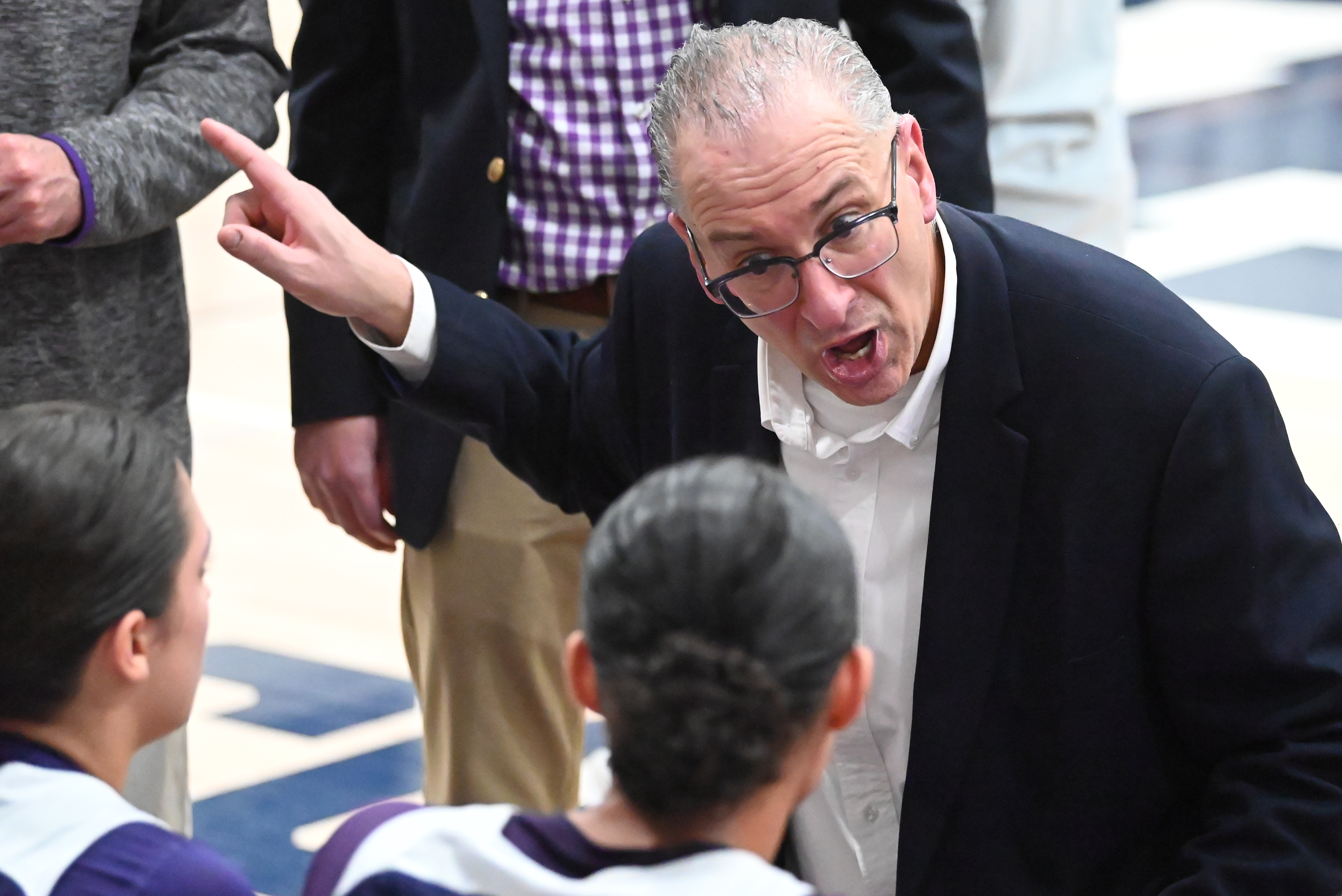 Scranton Prep’s Bob Beviglia talks to his players during the...
