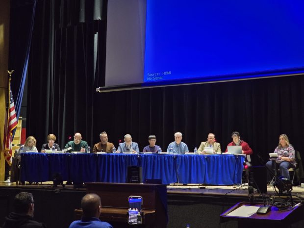 Archbald officials look on at the onset of a public hearing on a data center campus at the Valley View High School in Archbald on Wednesday, Feb. 11, 2026. (FRANK WILKES LESNEFSKY / STAFF PHOTO)