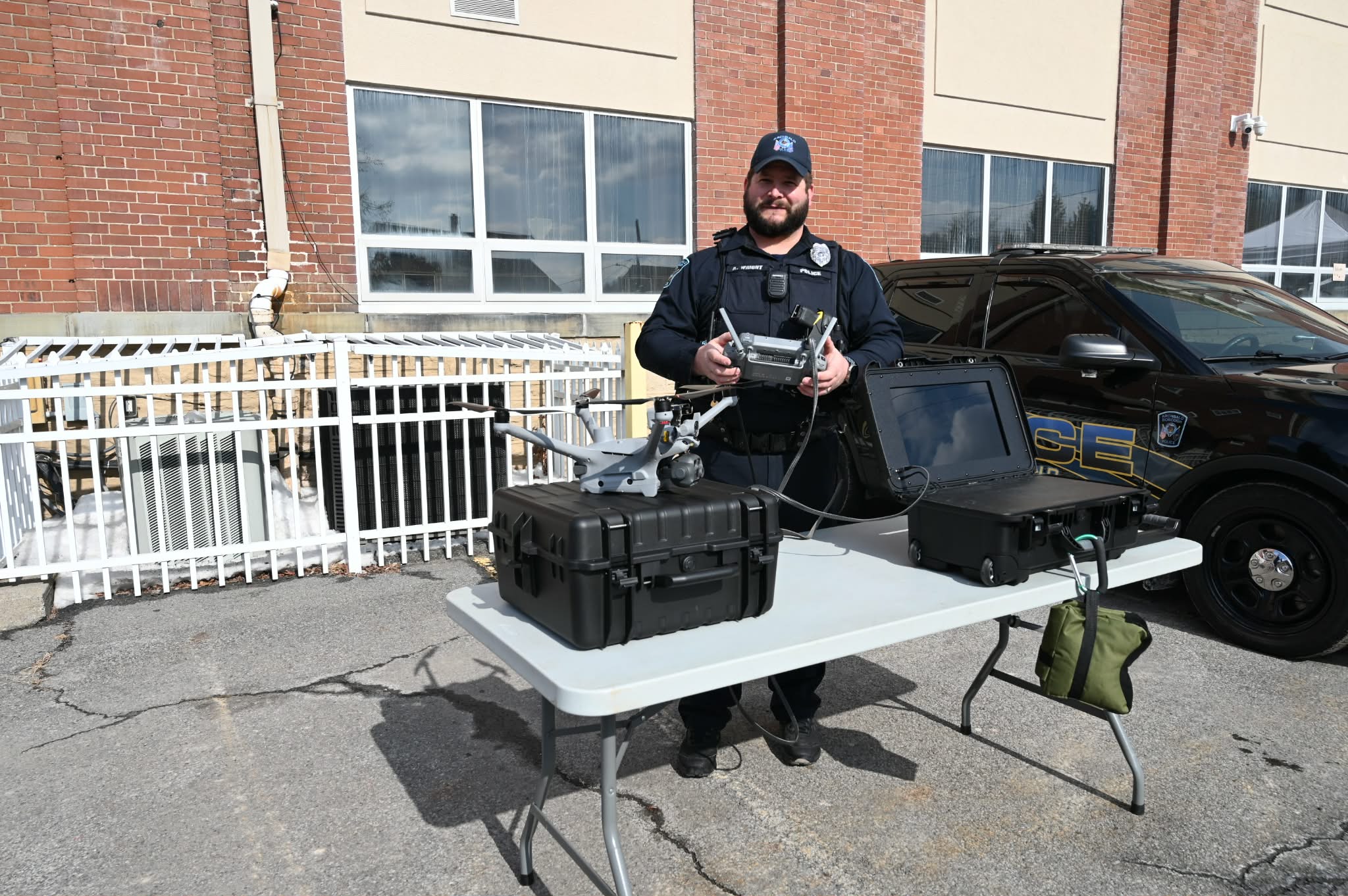 Archbald police Officer Alan Wright demonstrates a drone recently purchased...