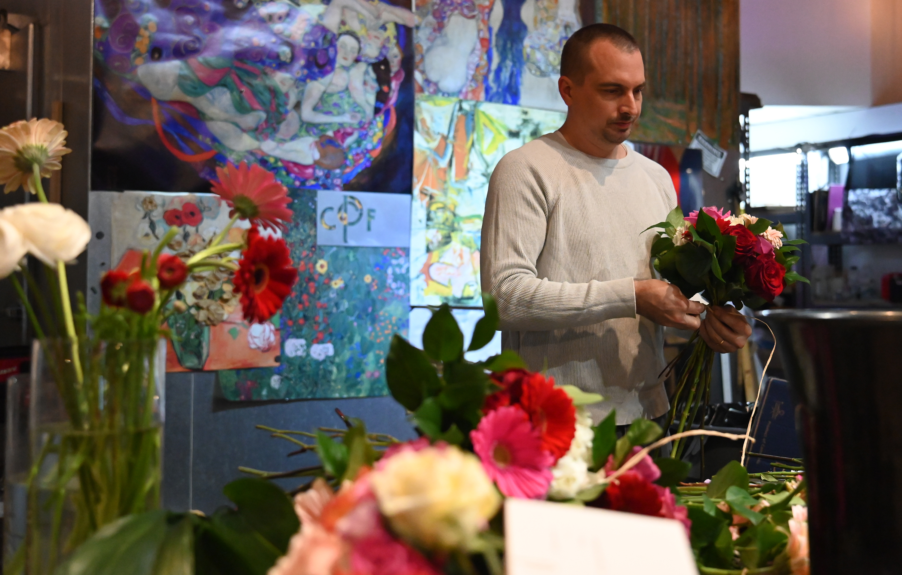 Owner Dorian Butovich arranges flowers at Central Park Flowers in...