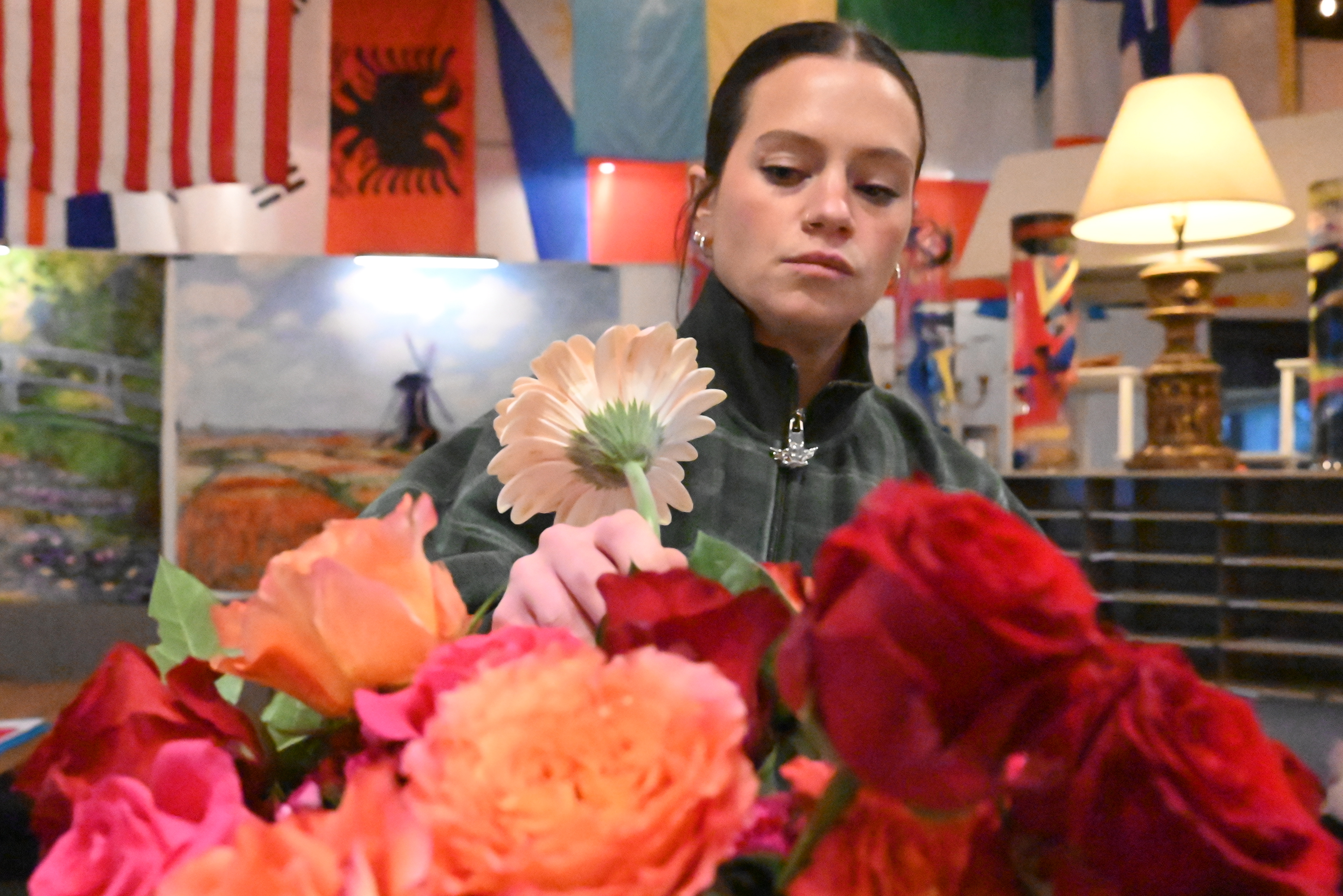 Employee Cecelia Ferraris works on an arrangement at Central Park...
