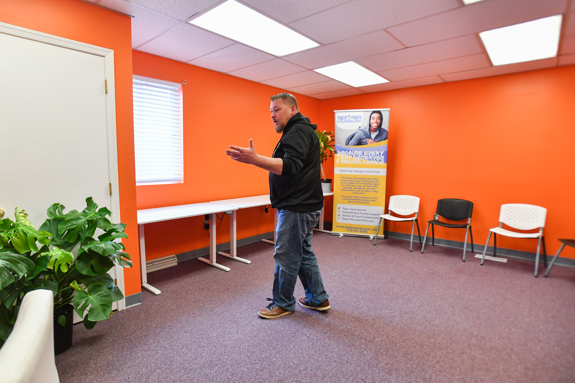 Founder of NextGen Counseling Jonathon Wasp shows off the new...