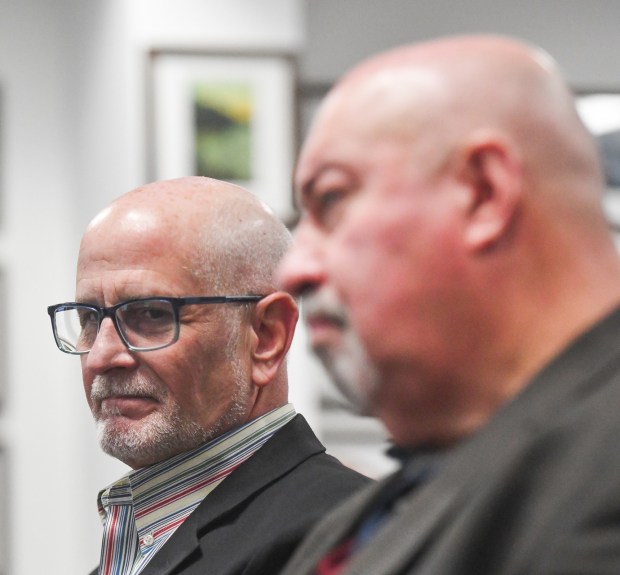 Berks County Chief Operations Officer Kevin Barnhardt, left, seated next to Berks County Deputy Chief Operations Officer Larry Medaglia, looks on during the commissioners meeting at the Lackawanna County Government Center Tuesday, February 24, 2026. (SEAN MCKEAG / STAFF PHOTOGRAPHER)