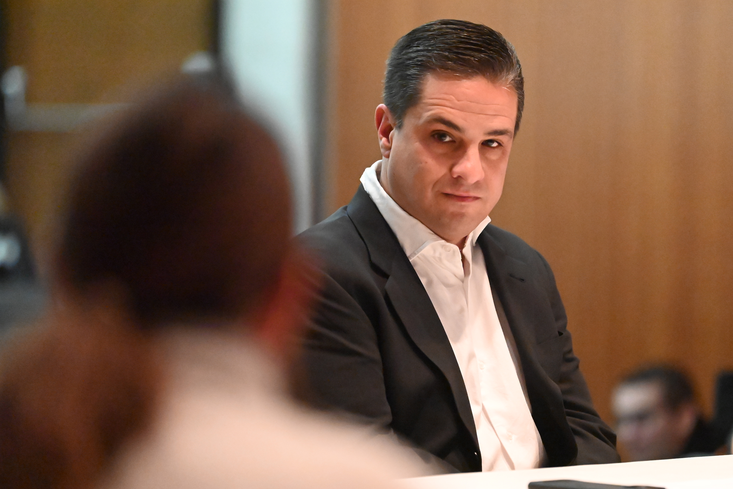 Abington Heights School District School Director Anthony Abdalla listens to...