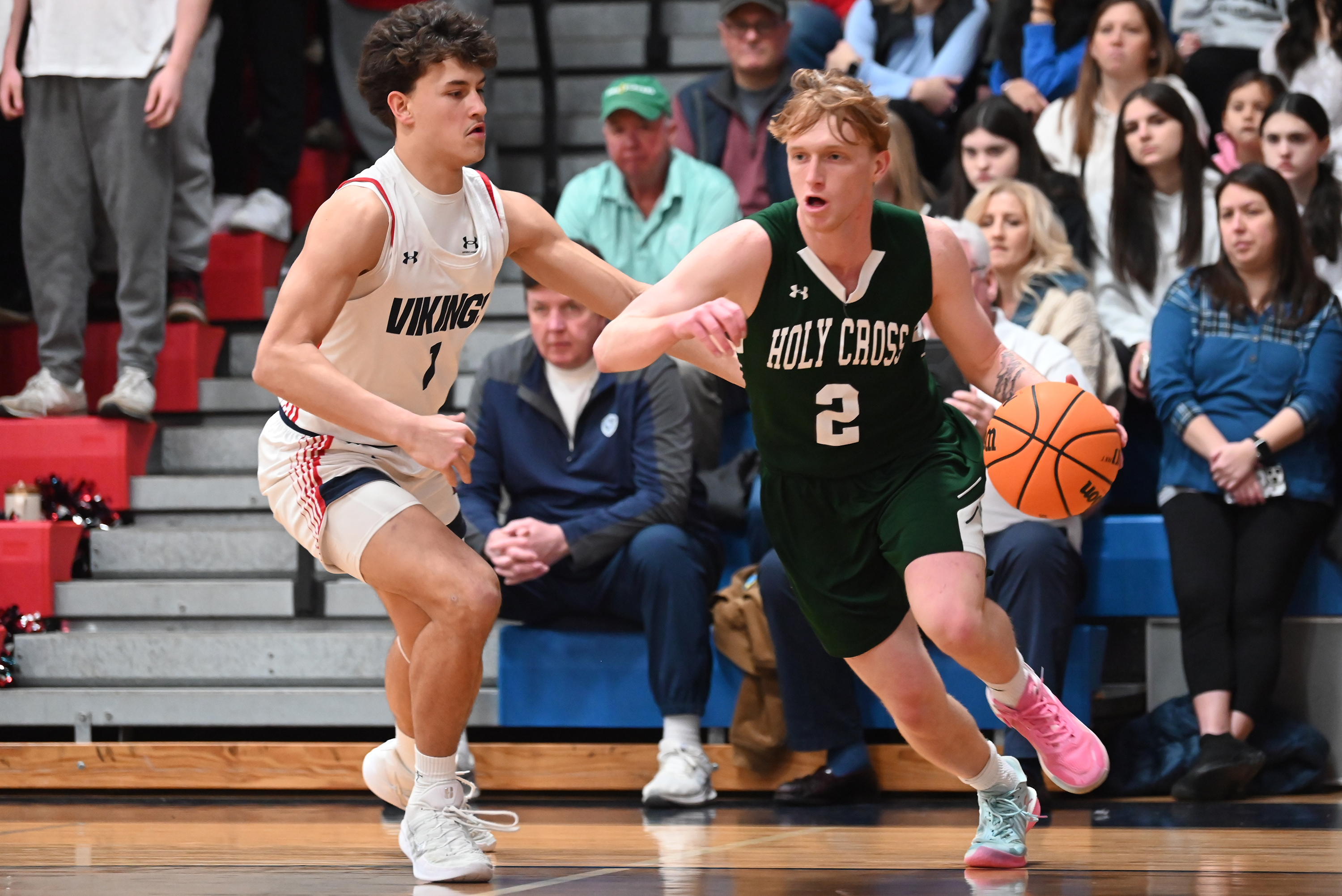 Riverside’s Brayden Rose defends Holy Cross’ Adam Badyrka during the...