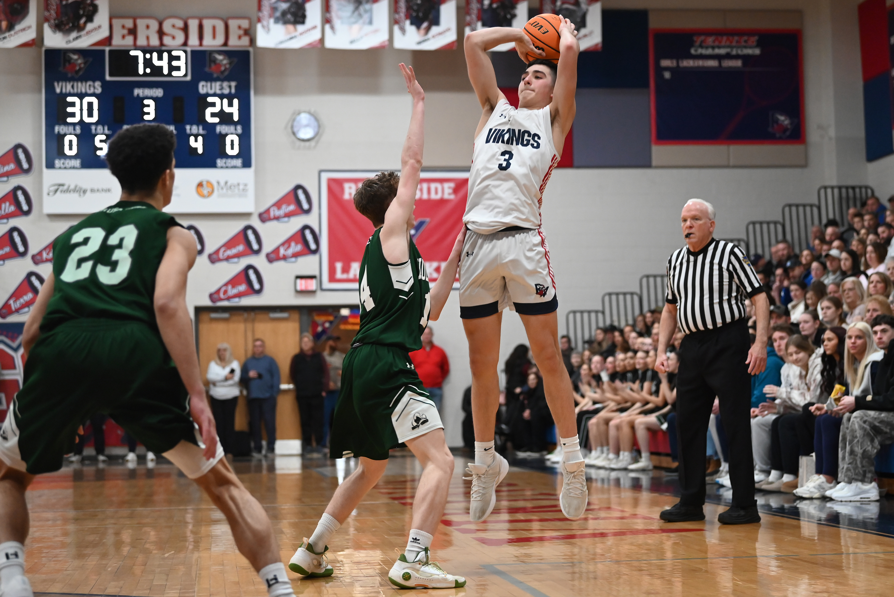 Holy Cross’ Colin Farrell defends Riverside’s Nico Antoniacci during the...