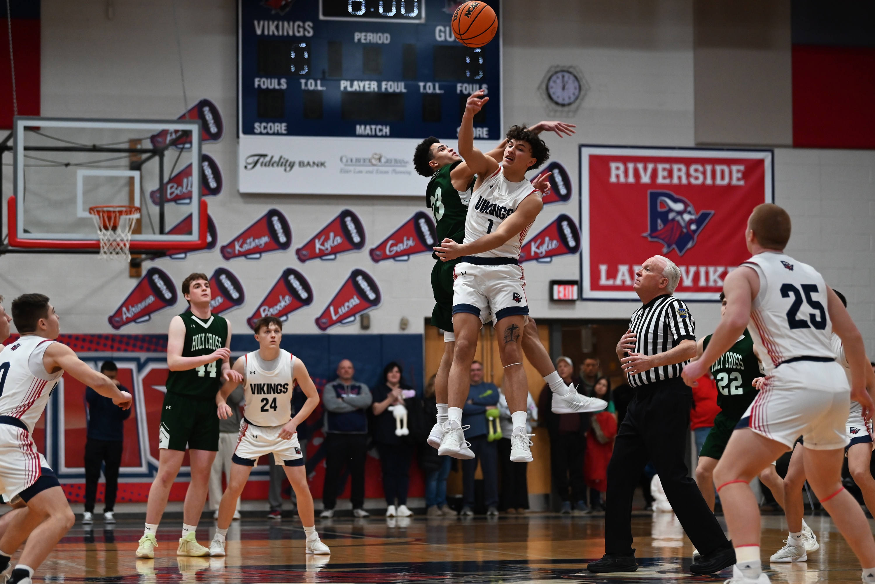 Riverside’s Brayden Rose and Holy Cross’ CJ Thompson participate in...