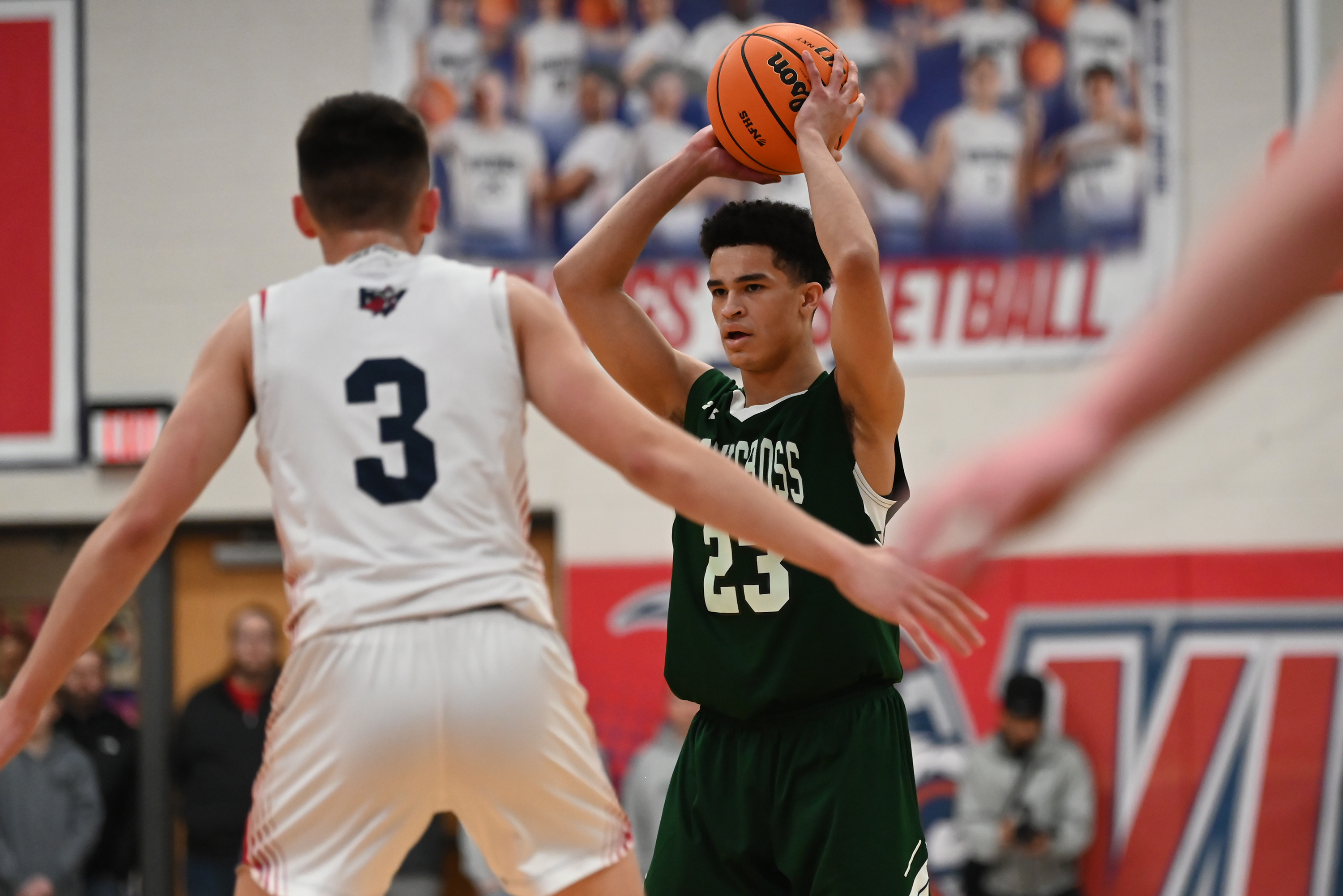 Riverside’s Nico Antoniacci defends Holy Cross’ CJ Thompson during the...