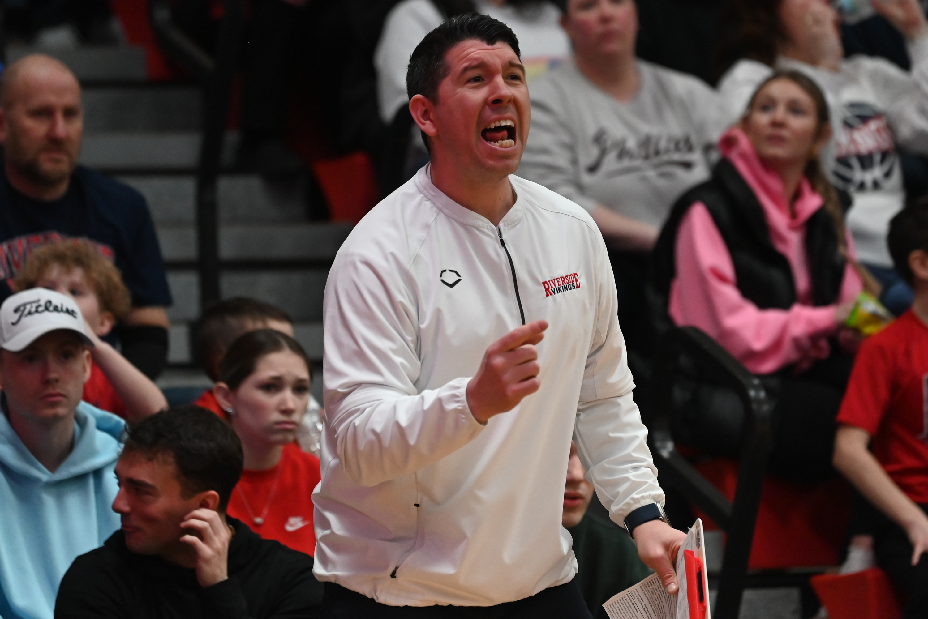 Riverside’s head coach Josh Aniska calls out to his players...