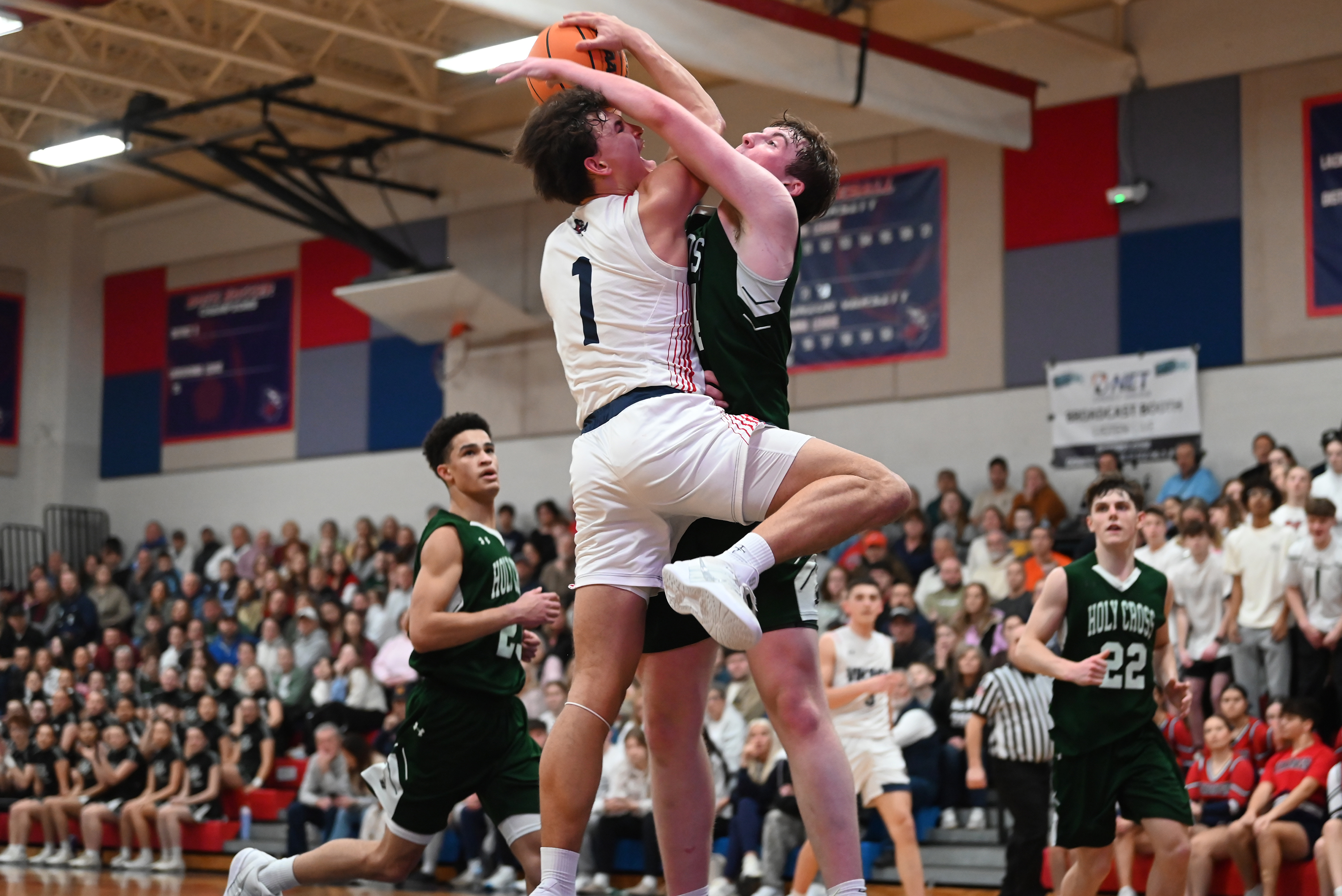 Holy Cross’ Colin Ritterbusch defends Riverside’s Brayden Rose during the...
