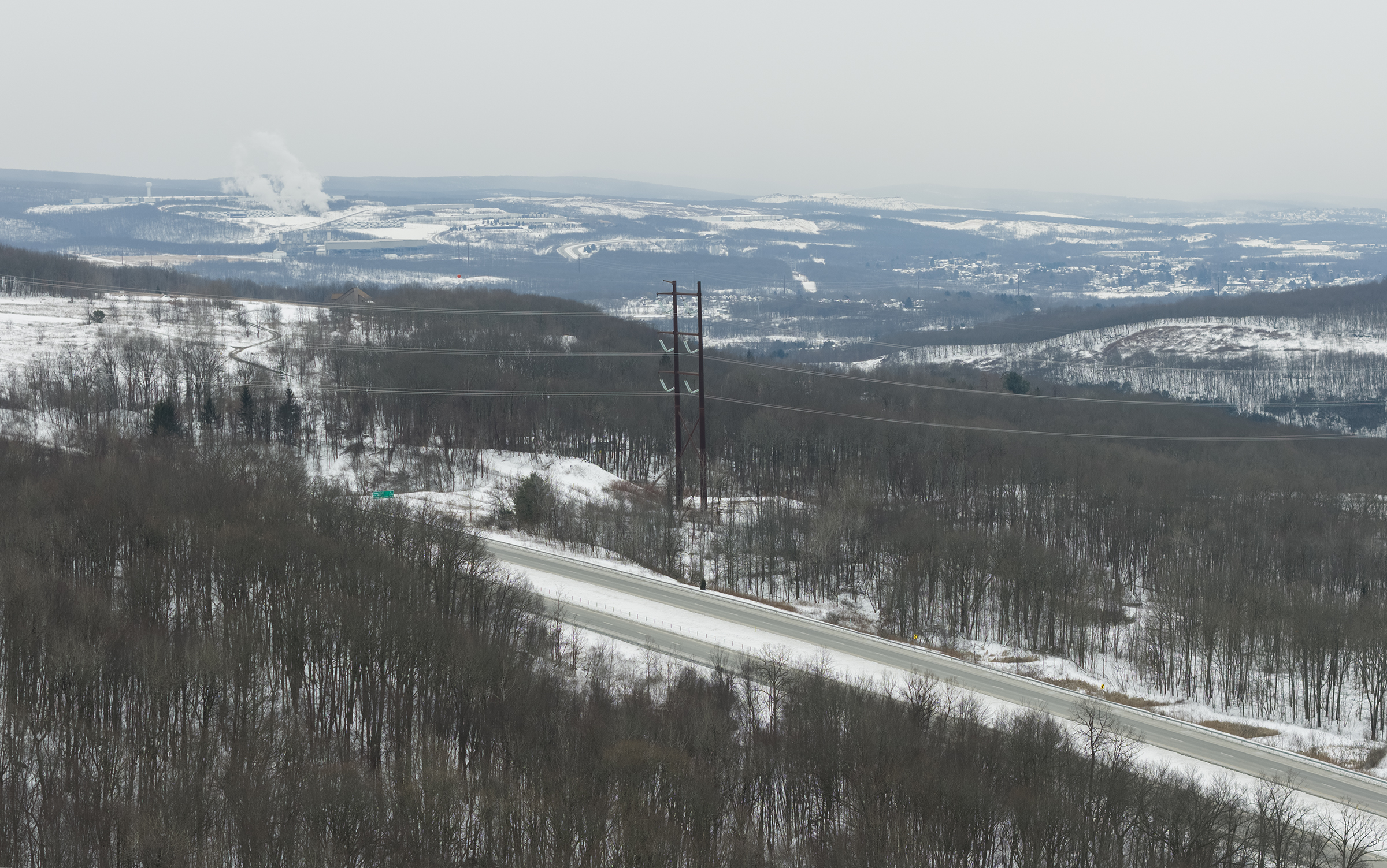 Power lines cross Route 6 in Arcbald Friday, February 6,...