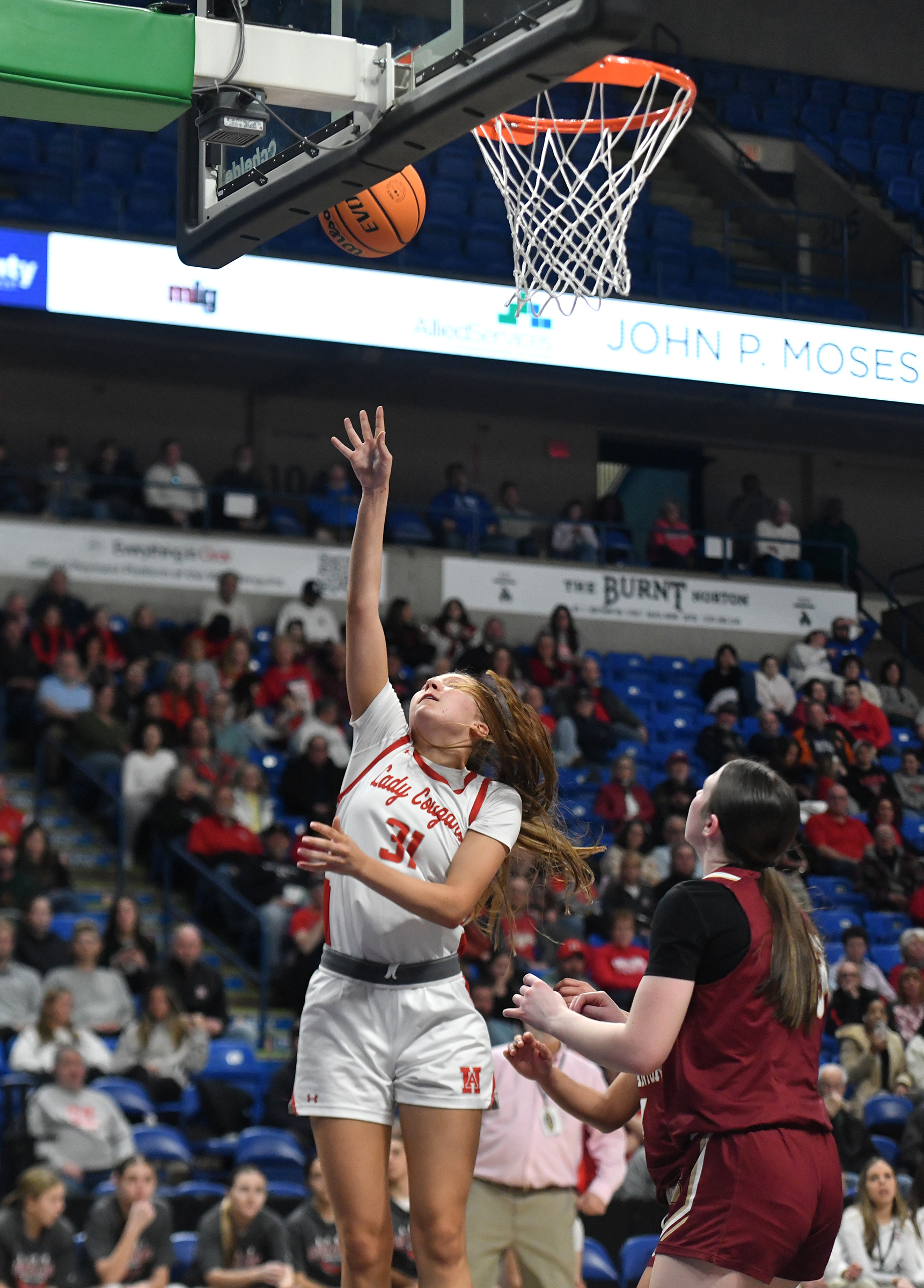 Hazleton Area’s Alexis Reimold scores a basket against Scranton during...