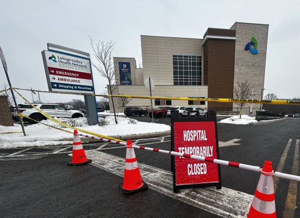 Caution tape and cones restrict public access to the front entrance of Leigh Valley Hospital-Dickson City in Dickson City Friday, February 6, 2026. (SEAN MCKEAG / STAFF PHOTOGRAPHER)