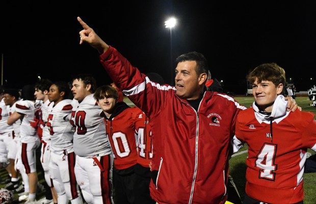 North Pocono Head Coach Greg Dolhon points to the fans after defeating Bishop Shanahan in a PIAA Class 4A first-round game at Jack Mancini Field in Downingtown Friday, Nov. 14, 2025. (SEAN MCKEAG / STAFF PHOTOGRAPHER)