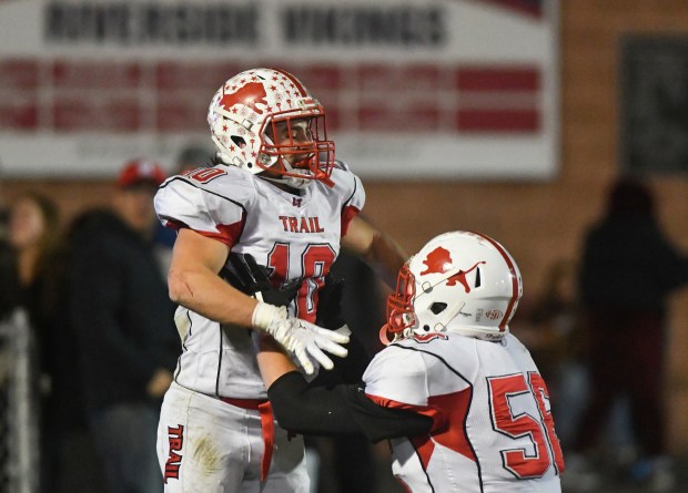 Lackawanna Trail's Blake Stage, right, and Isaac Ryon celebrate after Ryon scored a touchdown in the first half at Riverside Veterans Memorial Stadium in Taylor Friday, Oct. 24, 2025. (SEAN MCKEAG / STAFF PHOTOGRAPHER)