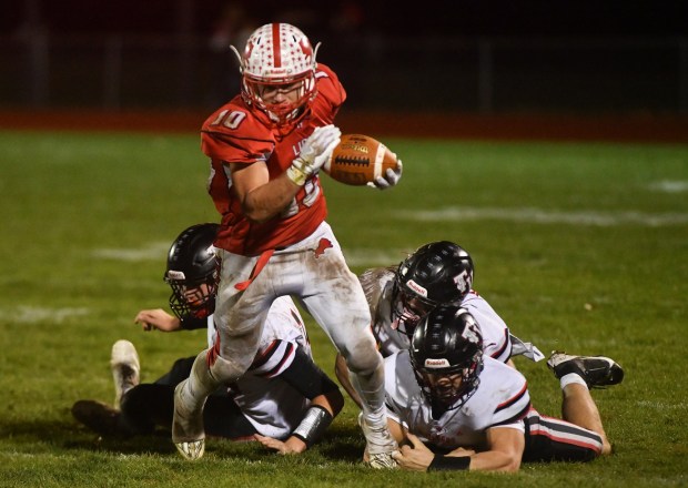 Lackawanna Trail's Isaac Ryon escapes a pack of Tri-Valley defenders during the PIAA District 2 Class 1A championship game at Lions Pride Stadium in Factoryville Friday, Nov. 7, 2025. (SEAN MCKEAG / STAFF PHOTOGRAPHER)