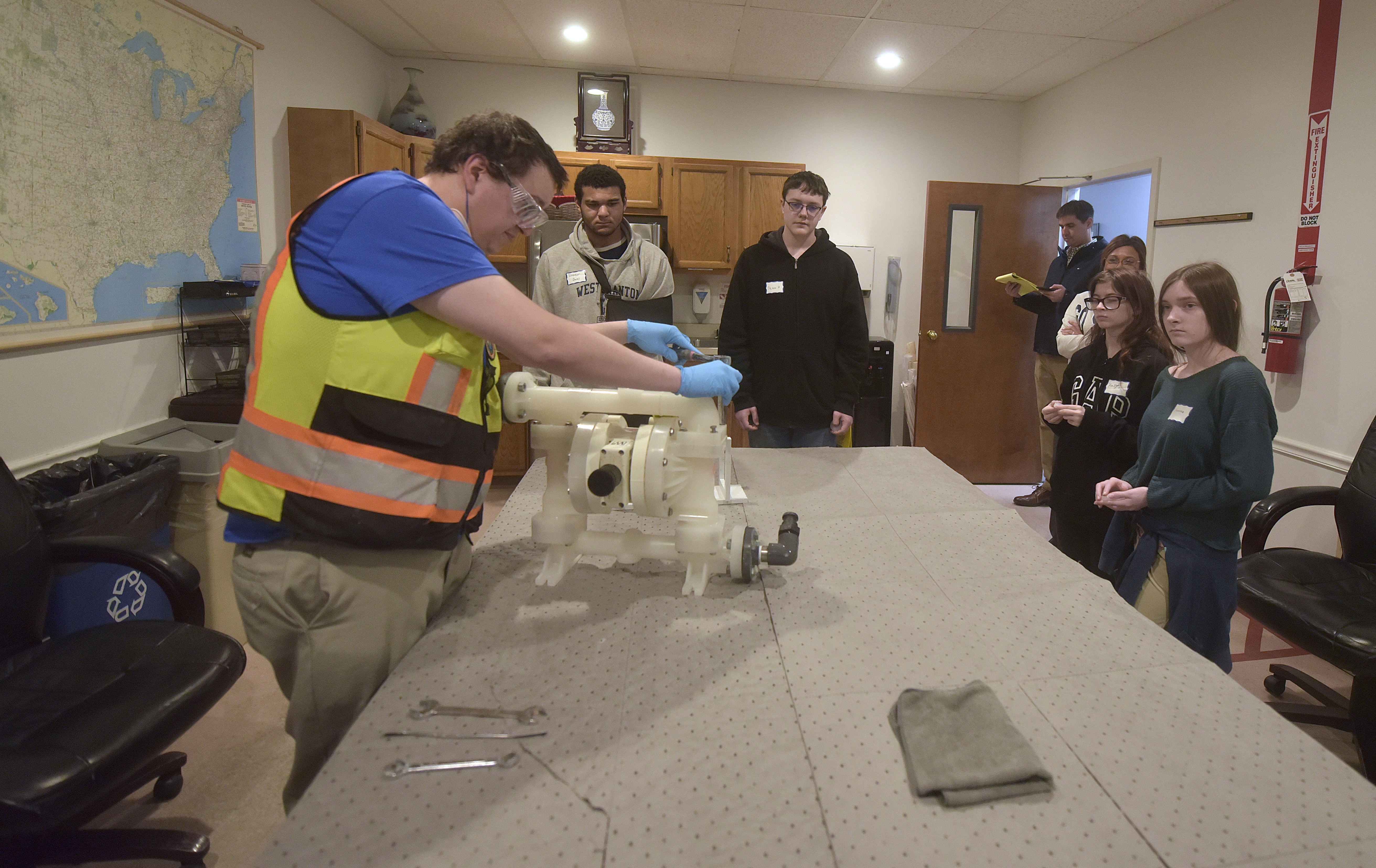 Briar Moore, a particle process operator at Saint-Gobain, talks to...