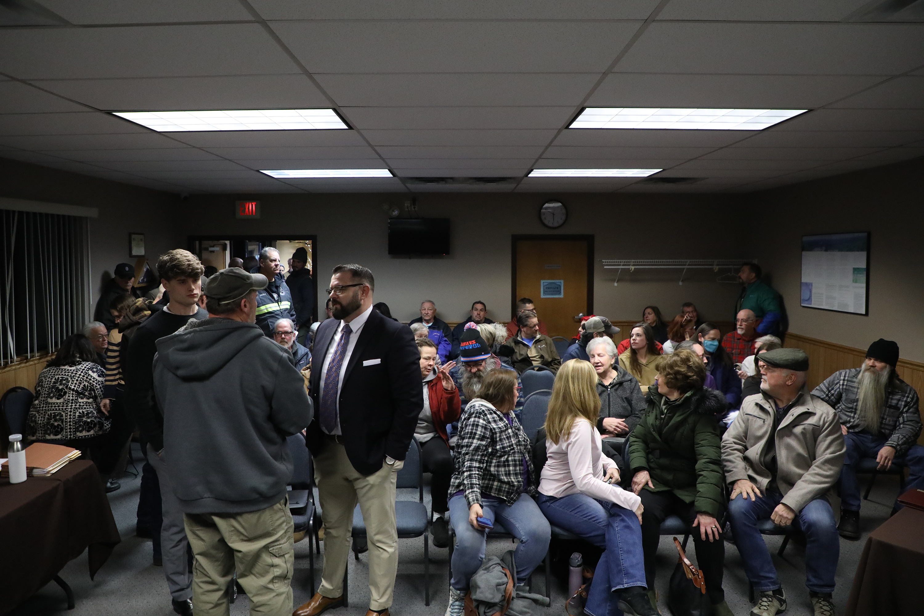 Community members crowd the Ransom Twp. municipal building in anticipation...