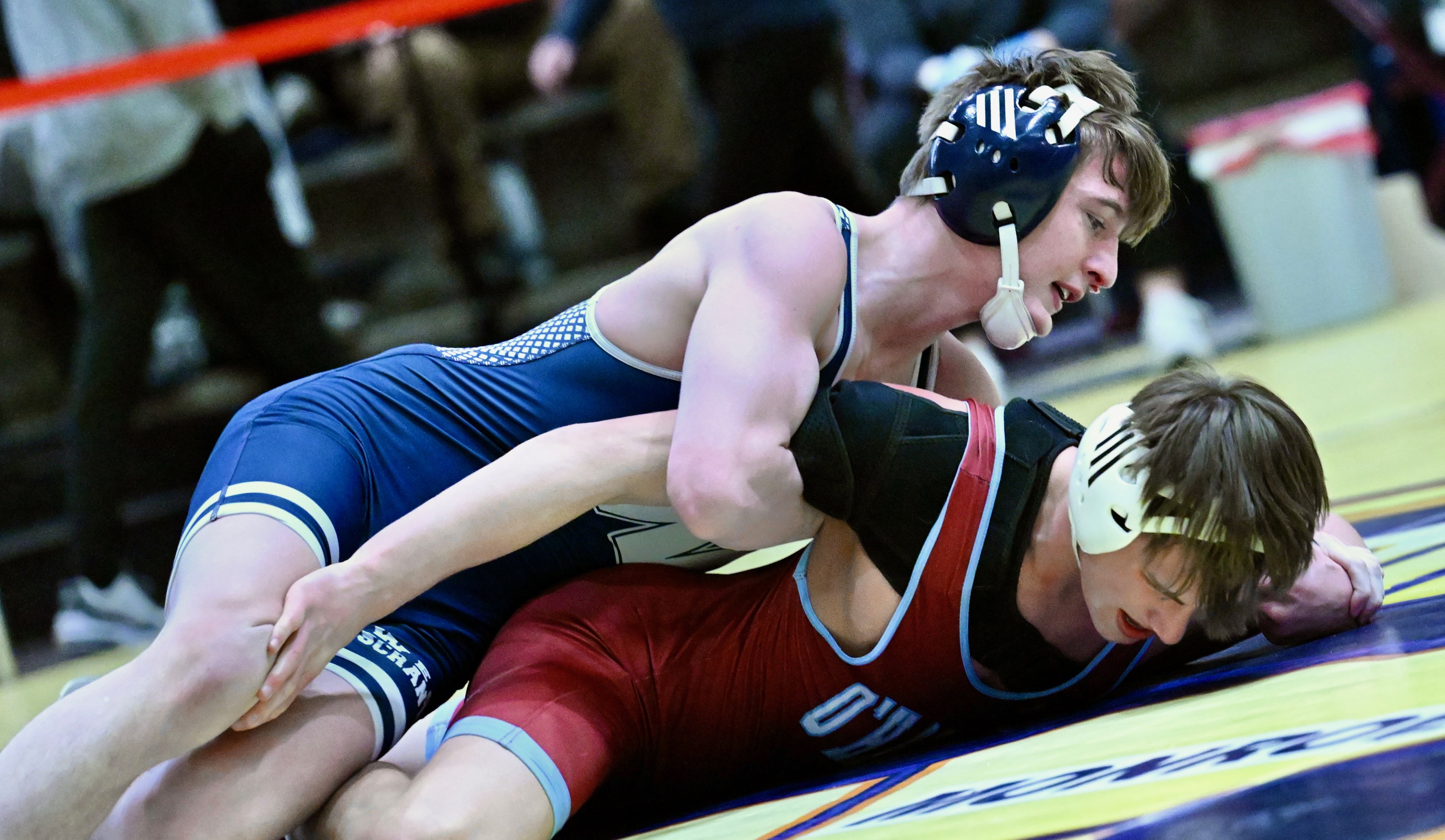 West Scranton’s Santino Aniska, top, wrestles Cardinal O’Hara’s Matt McCarthy...