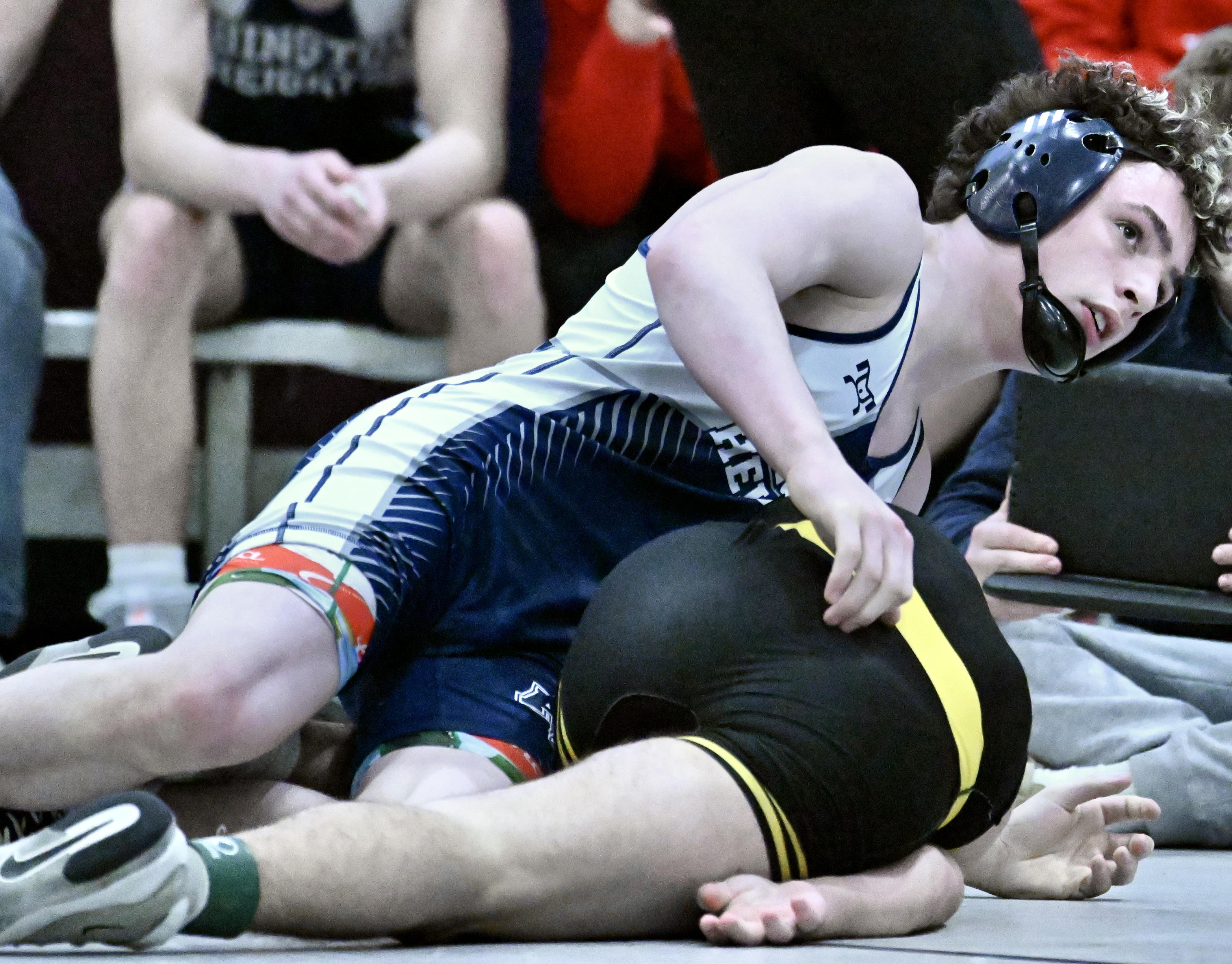 Abington Heights’ Lucas Drake, top, wrestles Freedom’s Nicholas Lyden in...