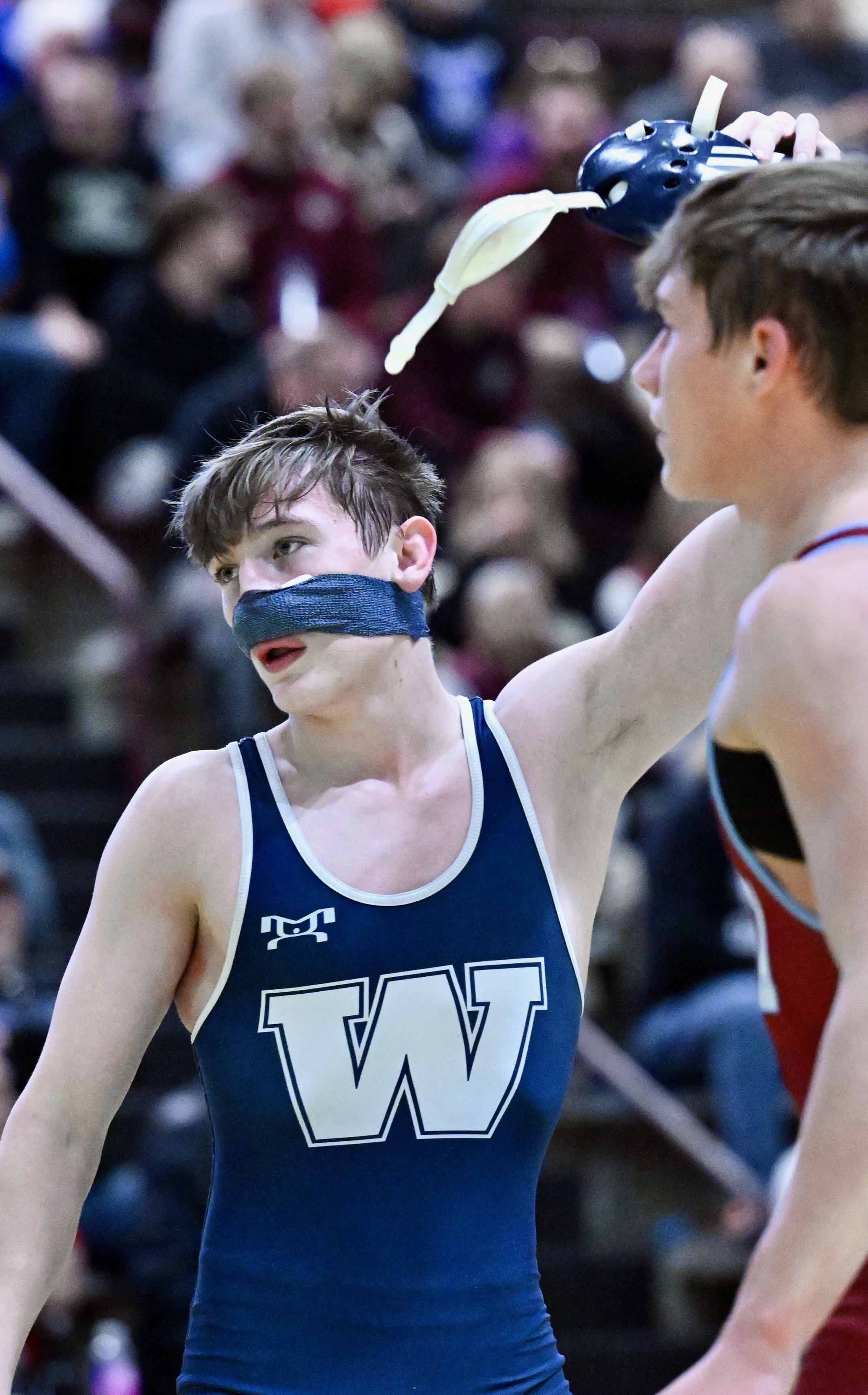 West Scranton’s Santino Aniska has his hand raised after winning...
