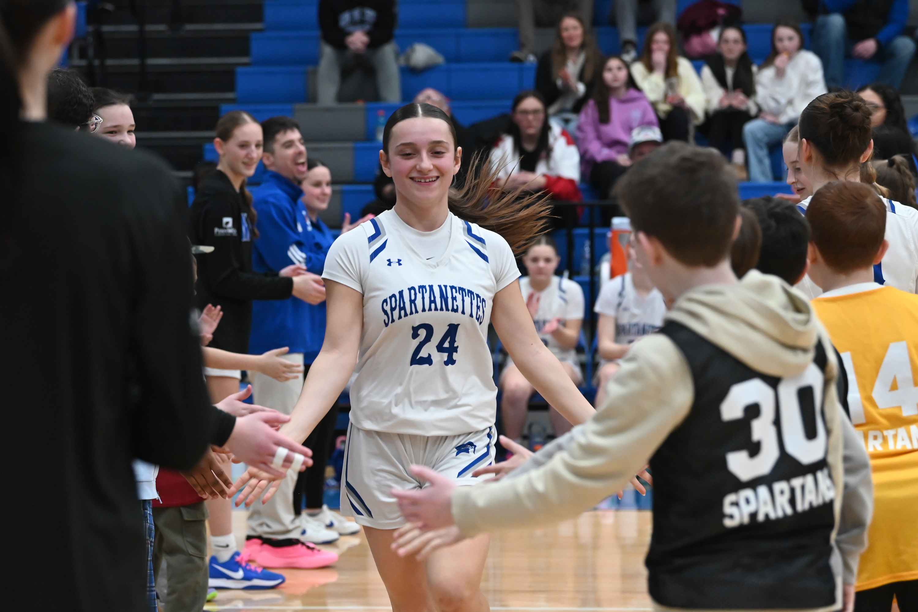 Mid Valley’s Gianna Pelosi runs onto the court before the...