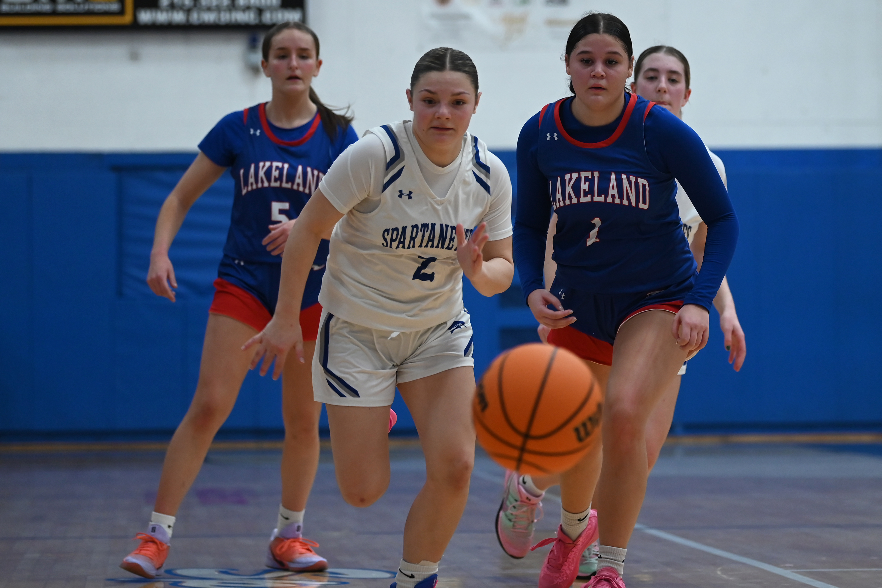 Mid Valley’s Parker Bennett and Lakeland’s Reina Walters chase the...