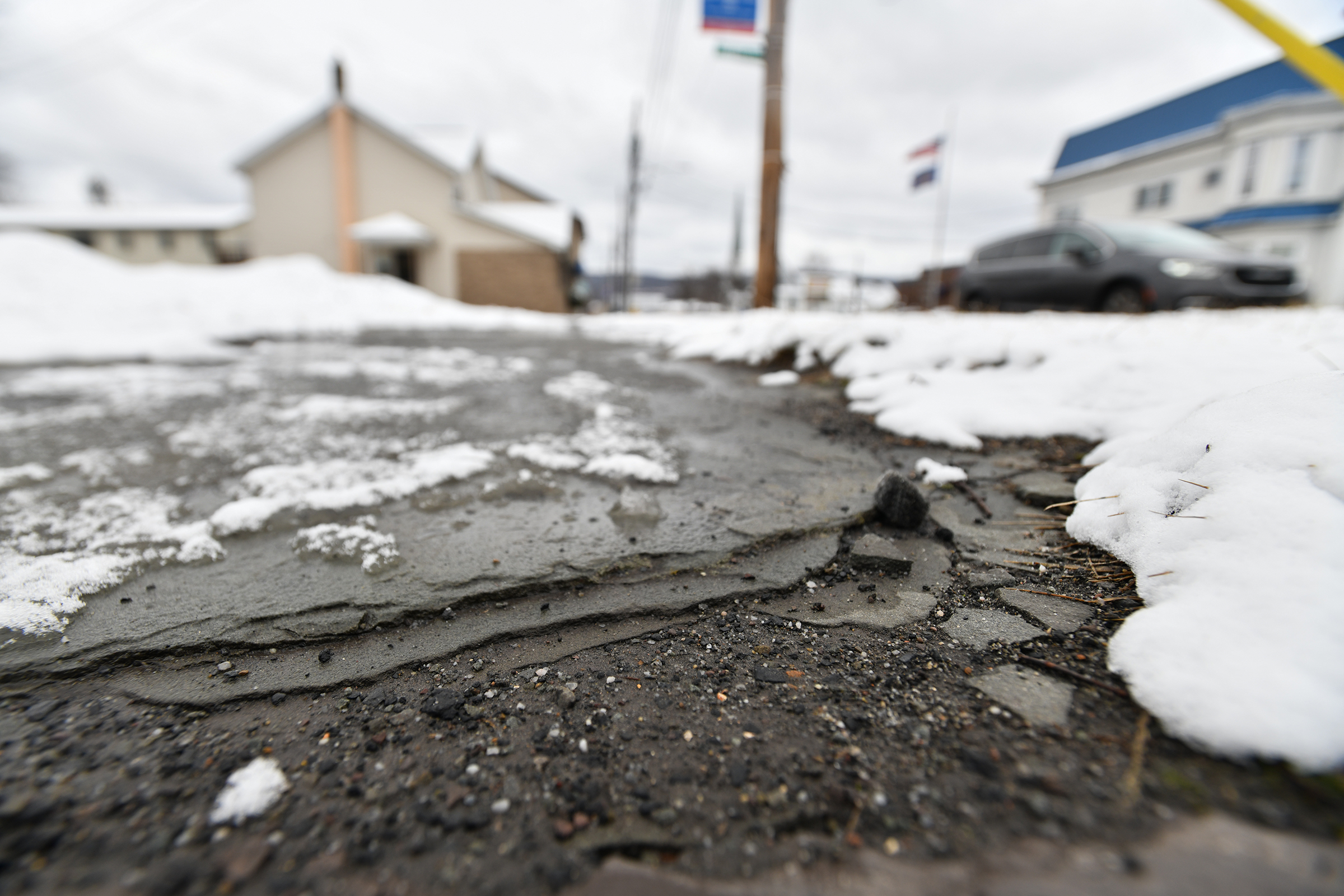 A broken sidwalk along Main St. in Moosic Monday, February...