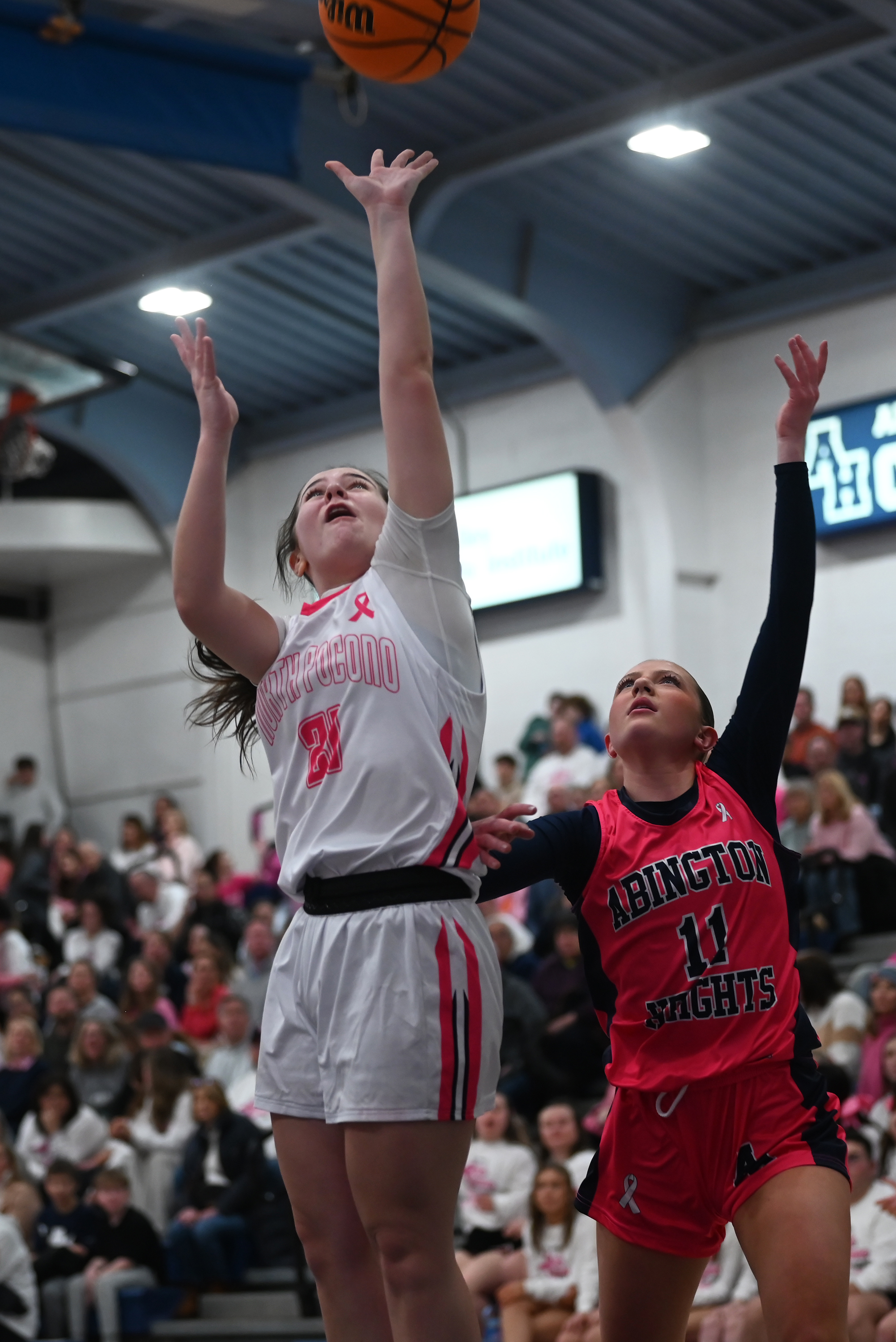 Abington Heights’ Abby Schneider defends North Pocono’s Aleah Quinn during...