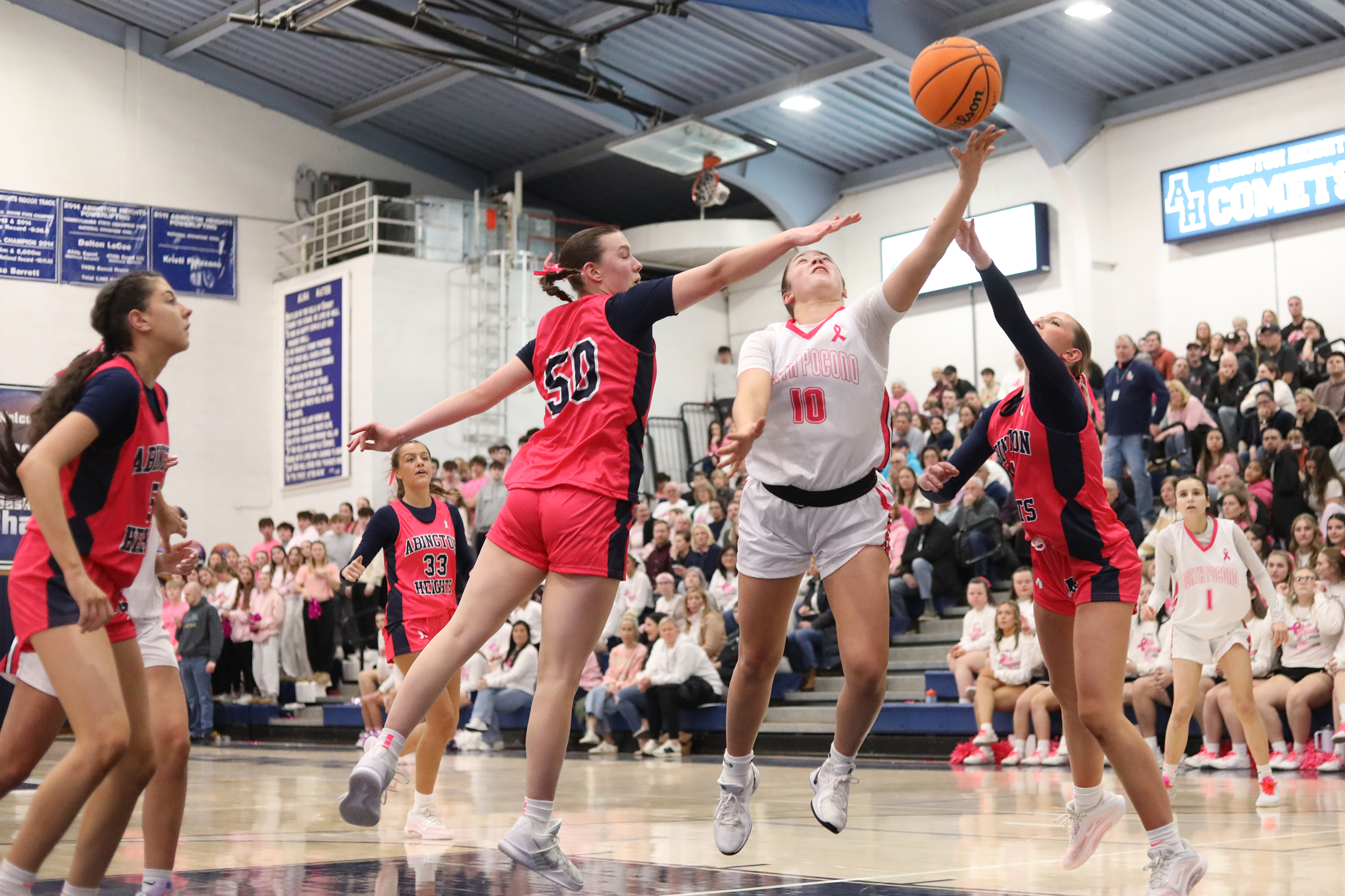Abington Heights’ Sarah Cantner (50) and Abby Schneider defend North...
