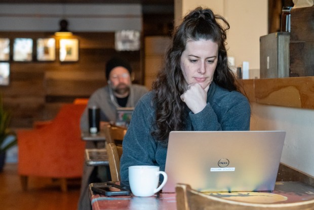 Samantha Knowleton looks at her laptop while grabbing coffee and breakfast at Northern Lights Espresso Bar in downtown Scranton on Friday, Feb. 27, 2026. (REBECCA PARTICKA/STAFF PHOTOGRAPHER)