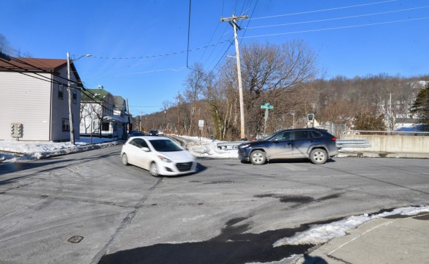 A vehicle turns onto the Gilmartin St. Bridge from N. Main St. in Archbald Friday, February 13, 2026. (SEAN MCKEAG / STAFF PHOTOGRAPHER)