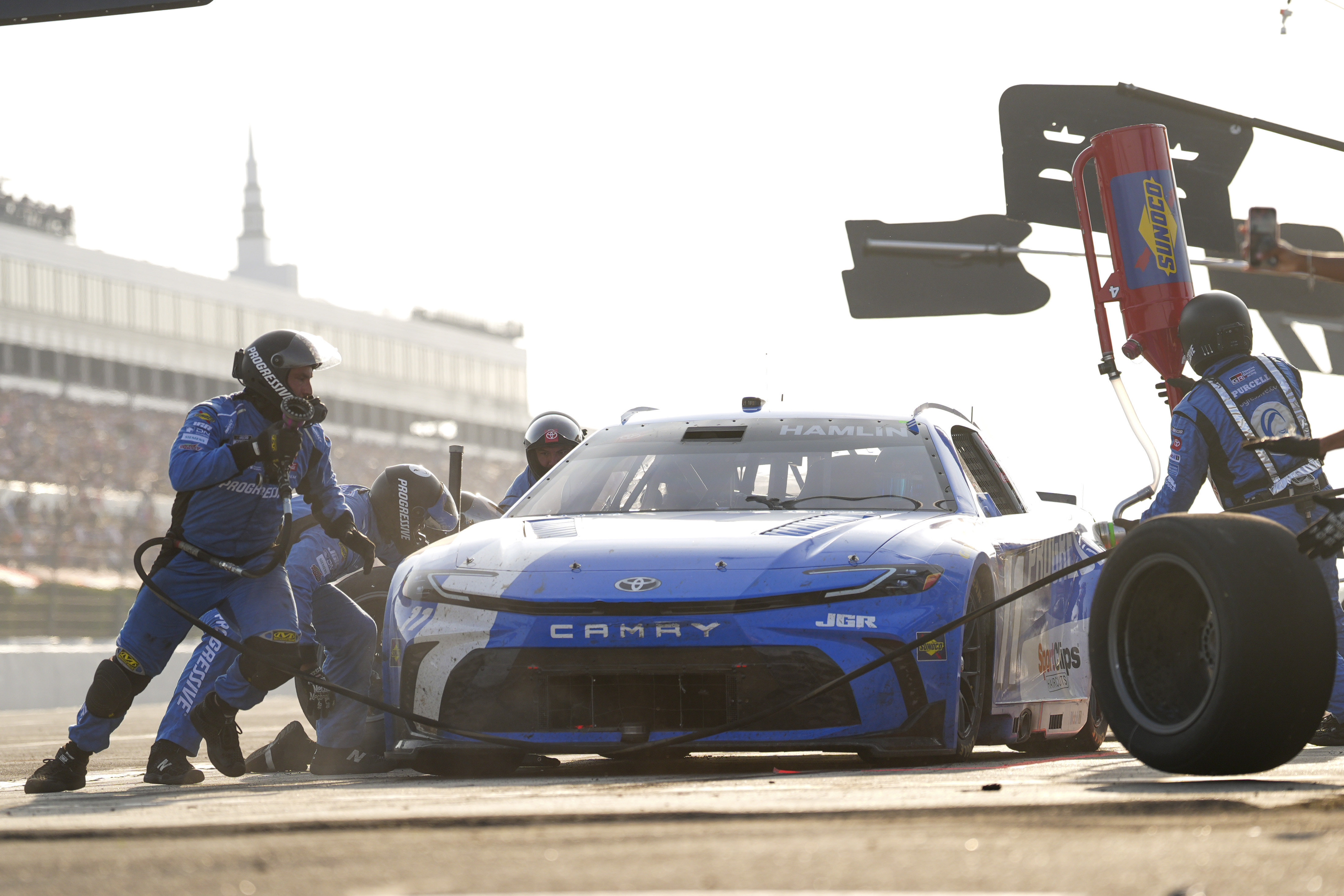Denny Hamlin makes a pit stop during a NASCAR Cup...