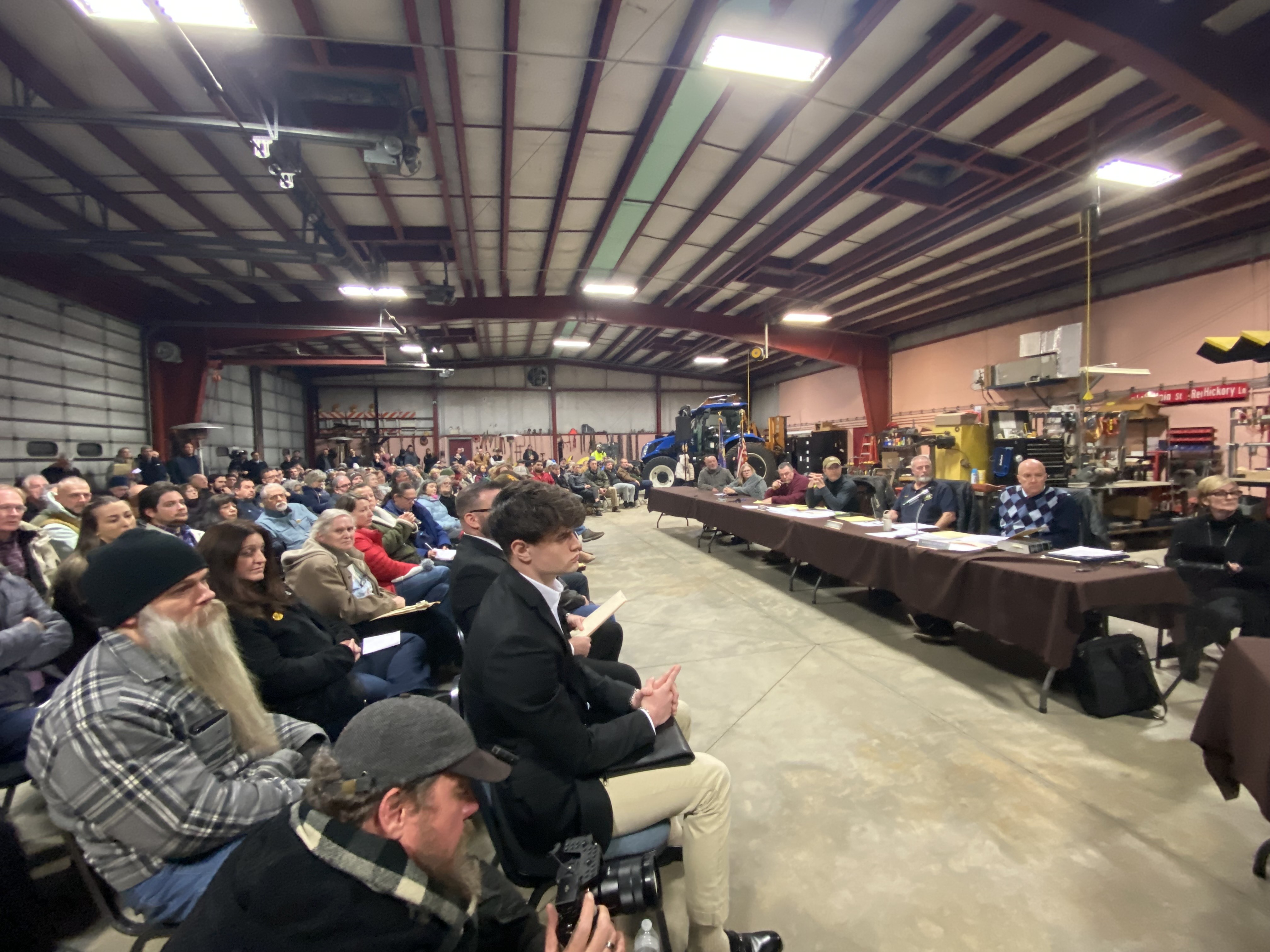 People fill the garage at the Ransom Twp. Municipal Building...