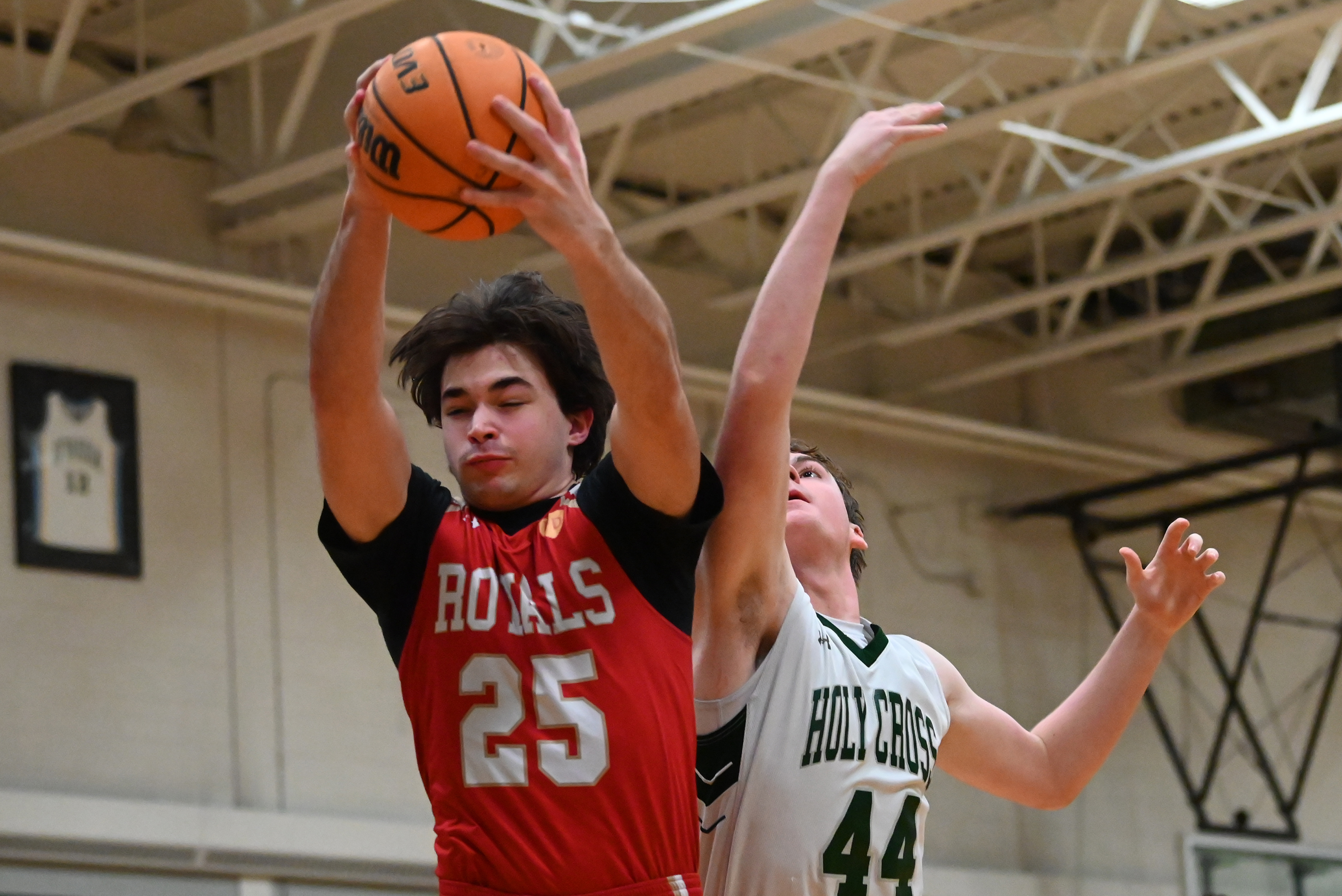 Holy Cross’ Colin Ritterbusch competes with Holy Redeemer’s Kaden Sepkoski...