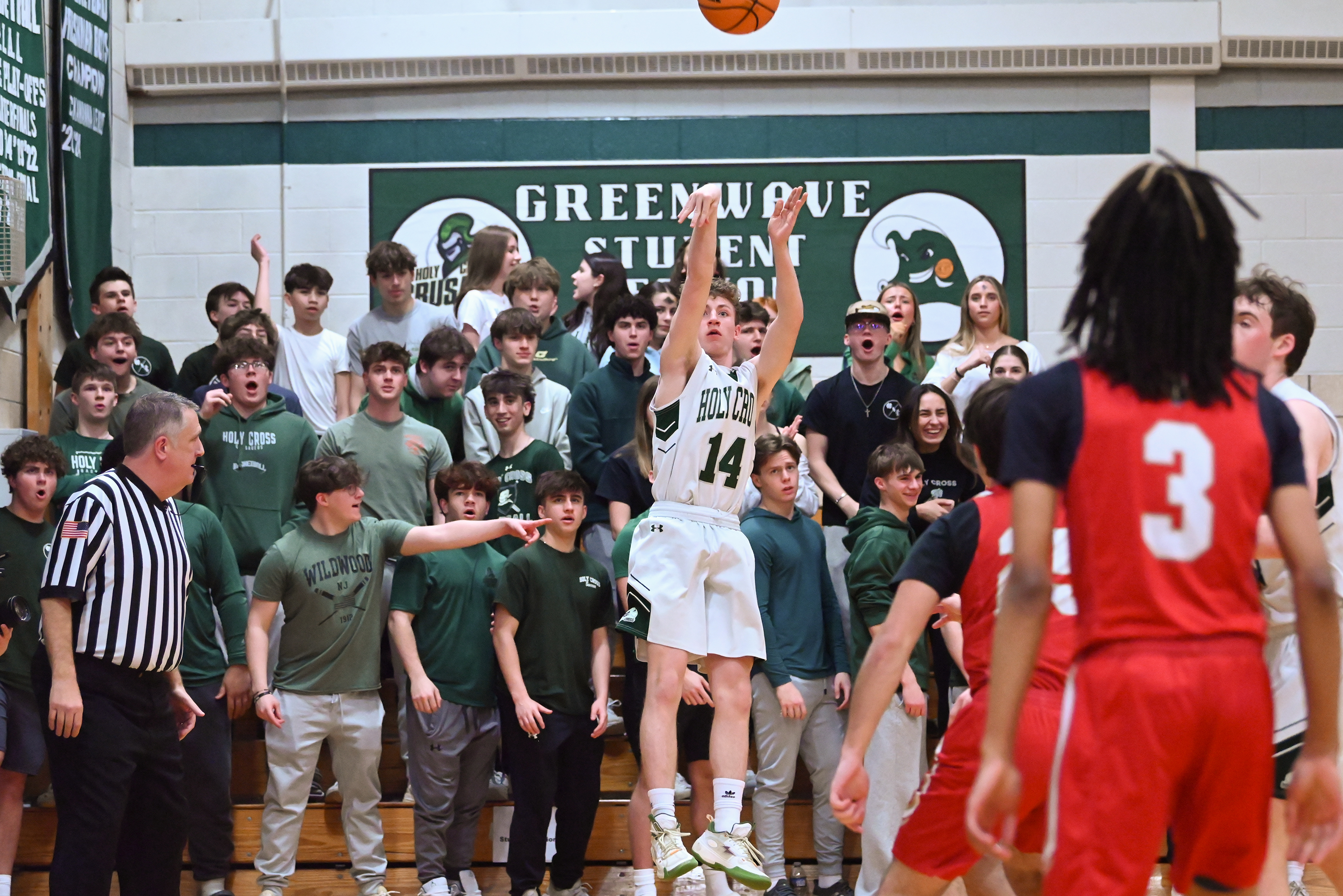 Holy Cross’ Colin Farrell takes a shot during the basketball...
